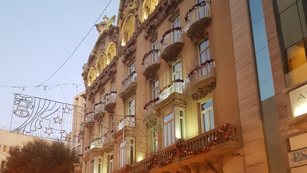 A historic building with ornate architecture, multiple balconies, and a prominent entrance. - Gran Hotel Albacete (Albacete)