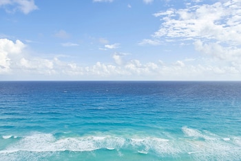 Premium bedding, minibar, in-room safe, desk at JW Marriott Cancun Resort & Spa