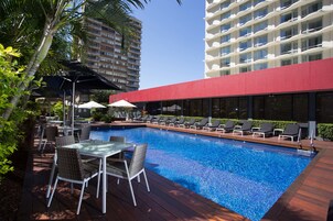 Outdoor pool, open 6:00 AM to 9:00 PM, pool loungers