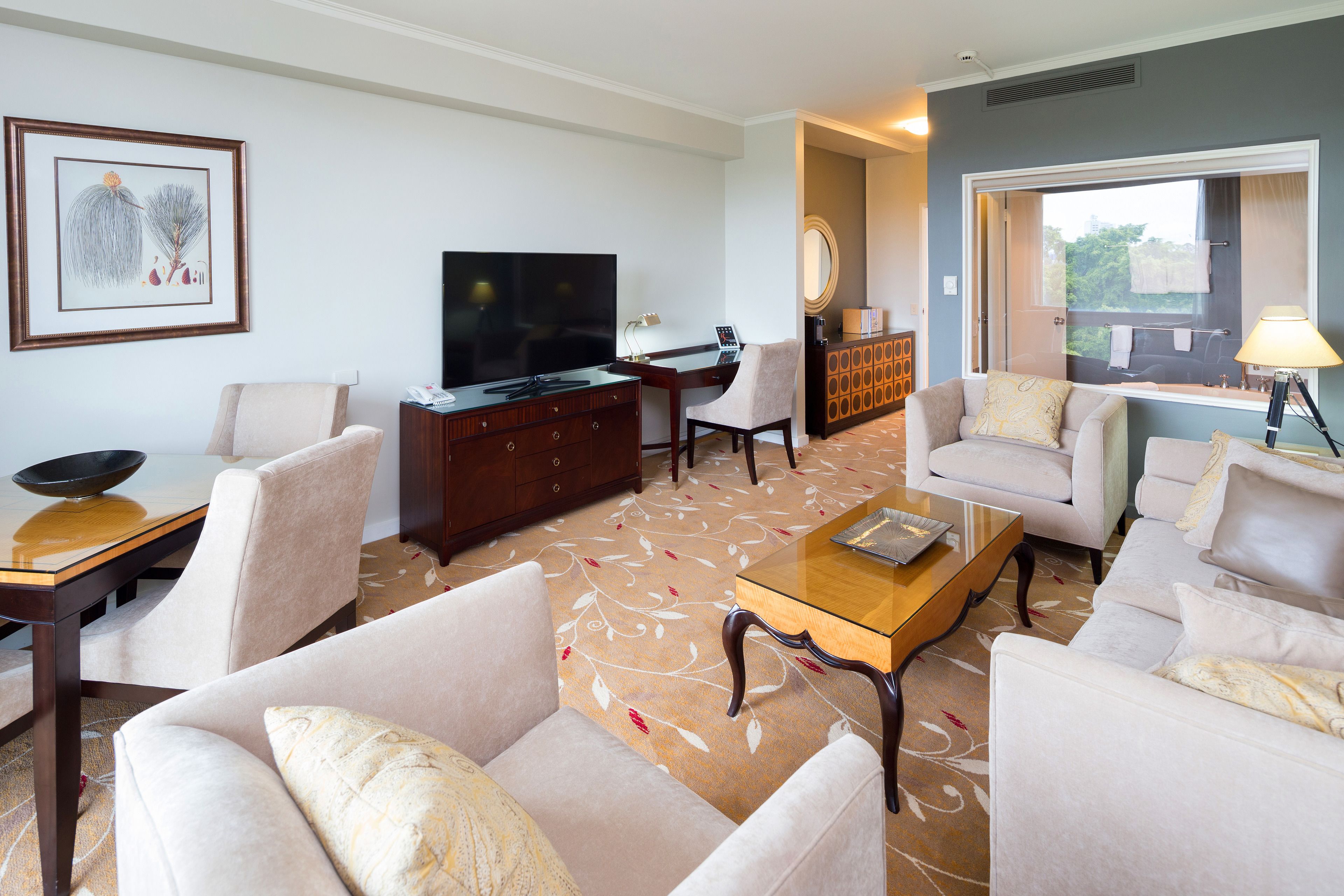 deluxe spa suite - inc. bottle of sparkling wine and complimentary self parking | living room | 49-inch lcd tv with digital channels, tv