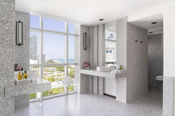 The Ritz-Carlton Suite | Bathroom | Separate tub and shower, deep soaking tub, designer toiletries at The Ritz-Carlton, South Beach