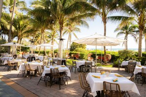 On the beach, white sand, beach cabanas, sun loungers