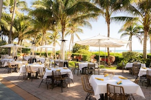 On the beach, white sand, beach cabanas, sun loungers