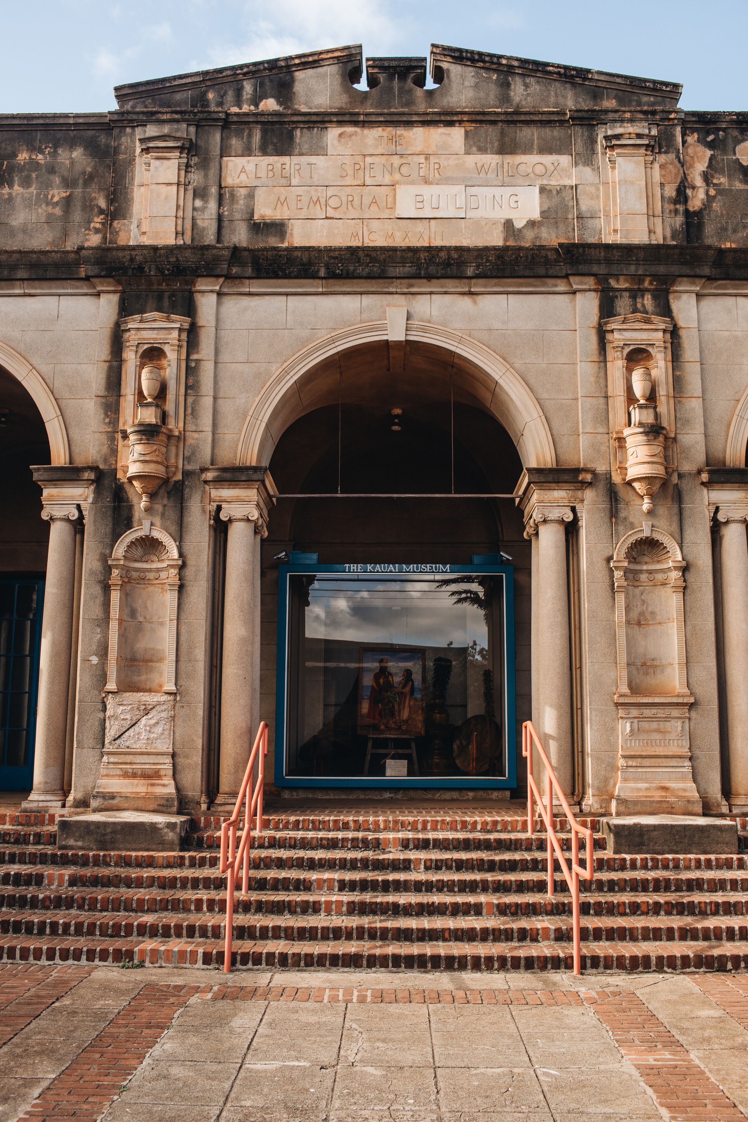The exterior of the Albert Spencer Wilcox Memorial Building with a large display window and steps leading up to the entrance.