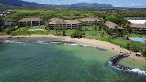 A resort with beachfront properties, a pool, and a golf course.