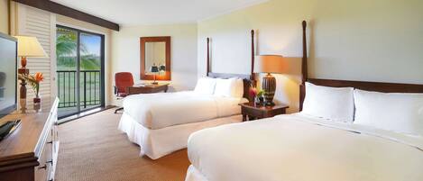 A hotel room with two beds, a television, a desk, a chair, and a balcony with a view.