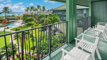Room, 1 King Bed (Pool Ocean View) | Down comforters, in-room safe, desk, laptop workspace