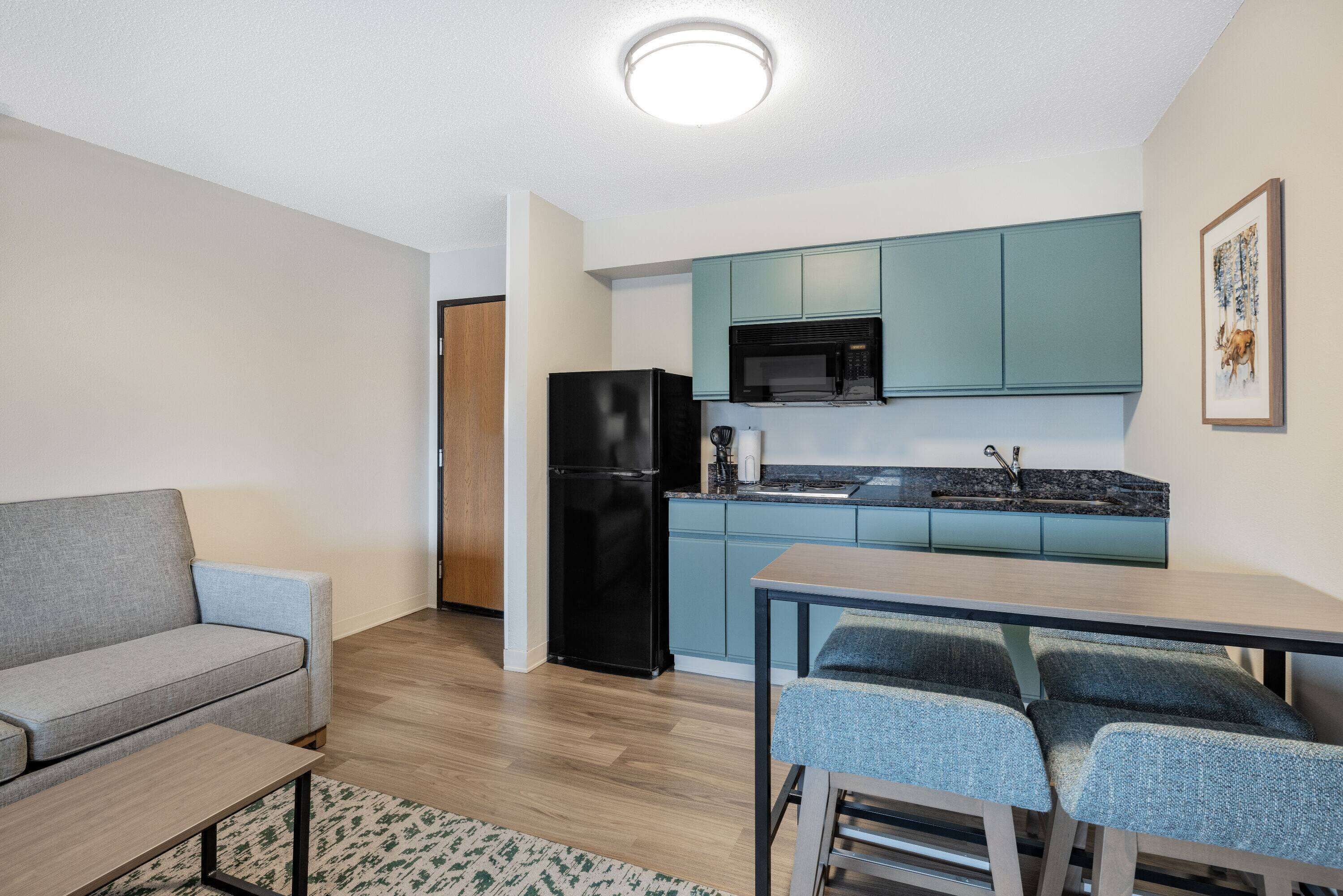 deluxe suite, 1 bedroom, non smoking (1 king bed & 1 queen bed) | desk, blackout curtains, iron/ironing board, rollaway beds