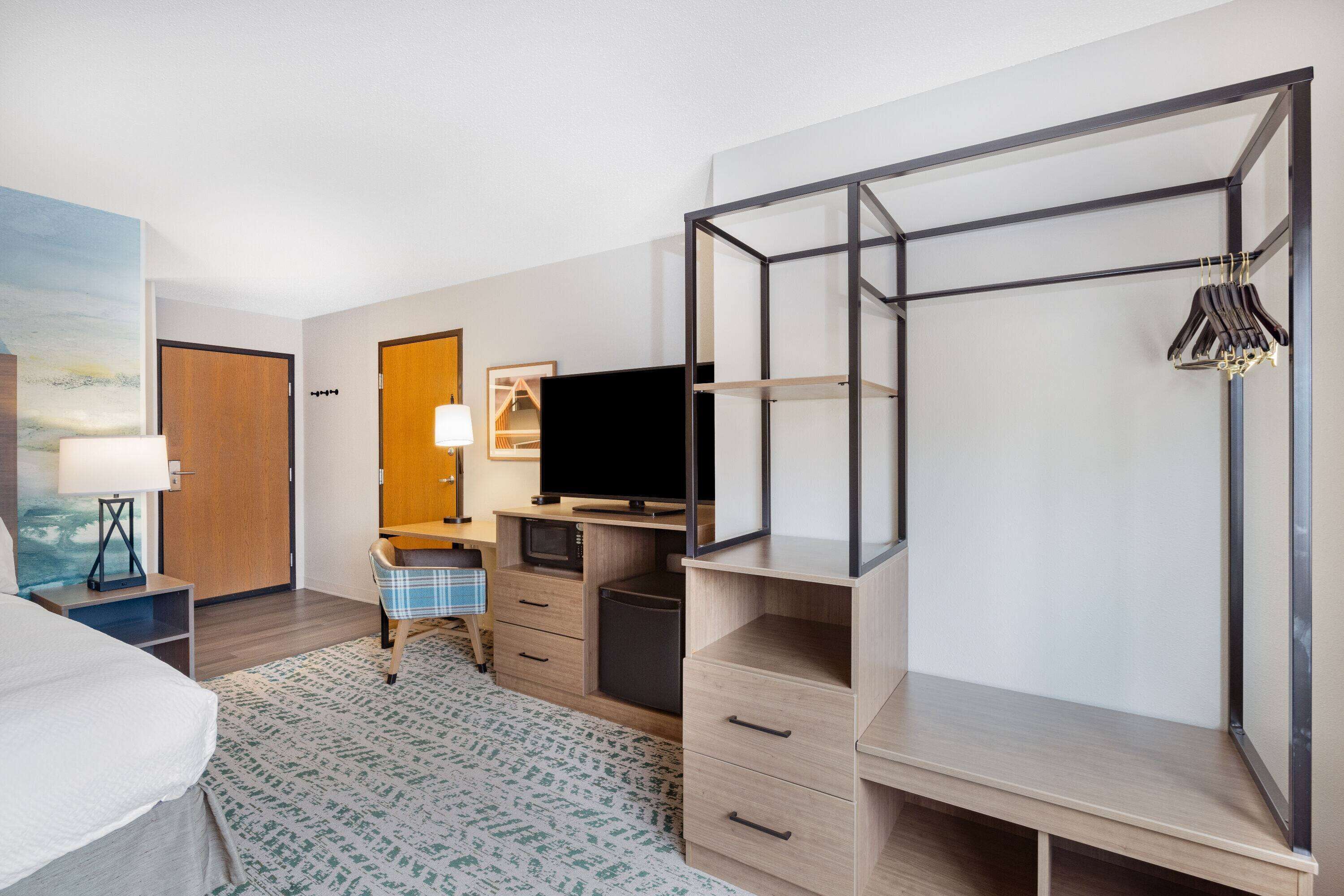 desk, blackout curtains, iron/ironing board, rollaway beds