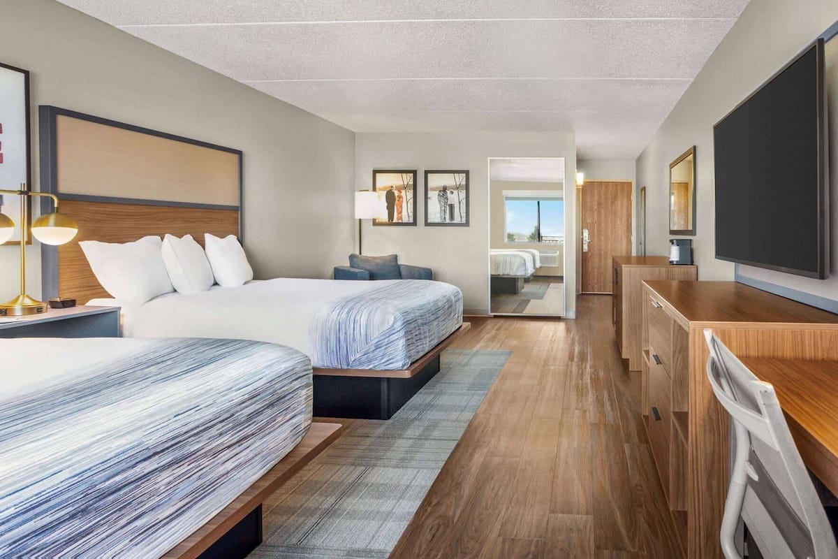 Desk, laptop workspace, blackout drapes, iron/ironing board