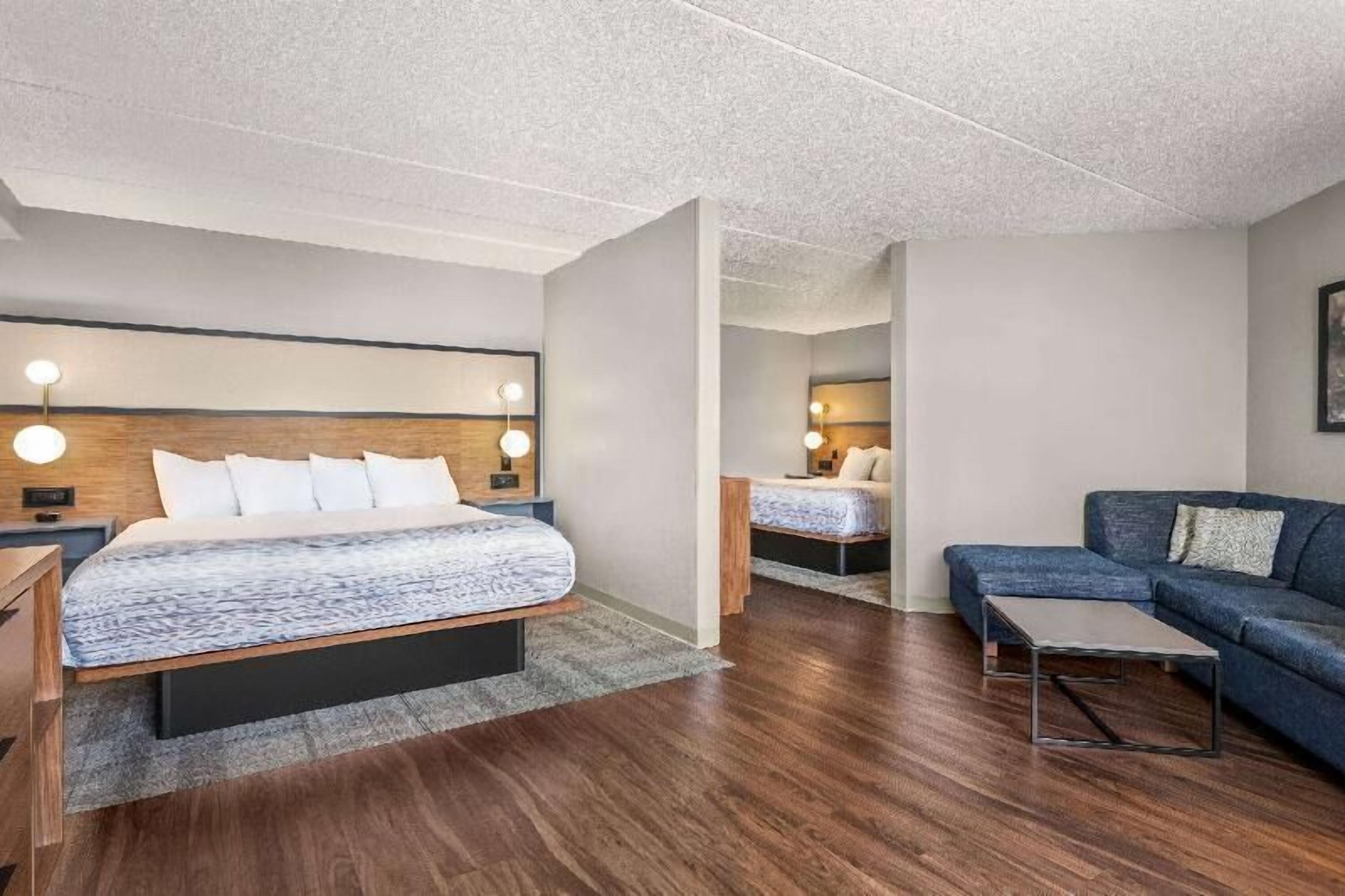 Desk, laptop workspace, blackout drapes, iron/ironing board