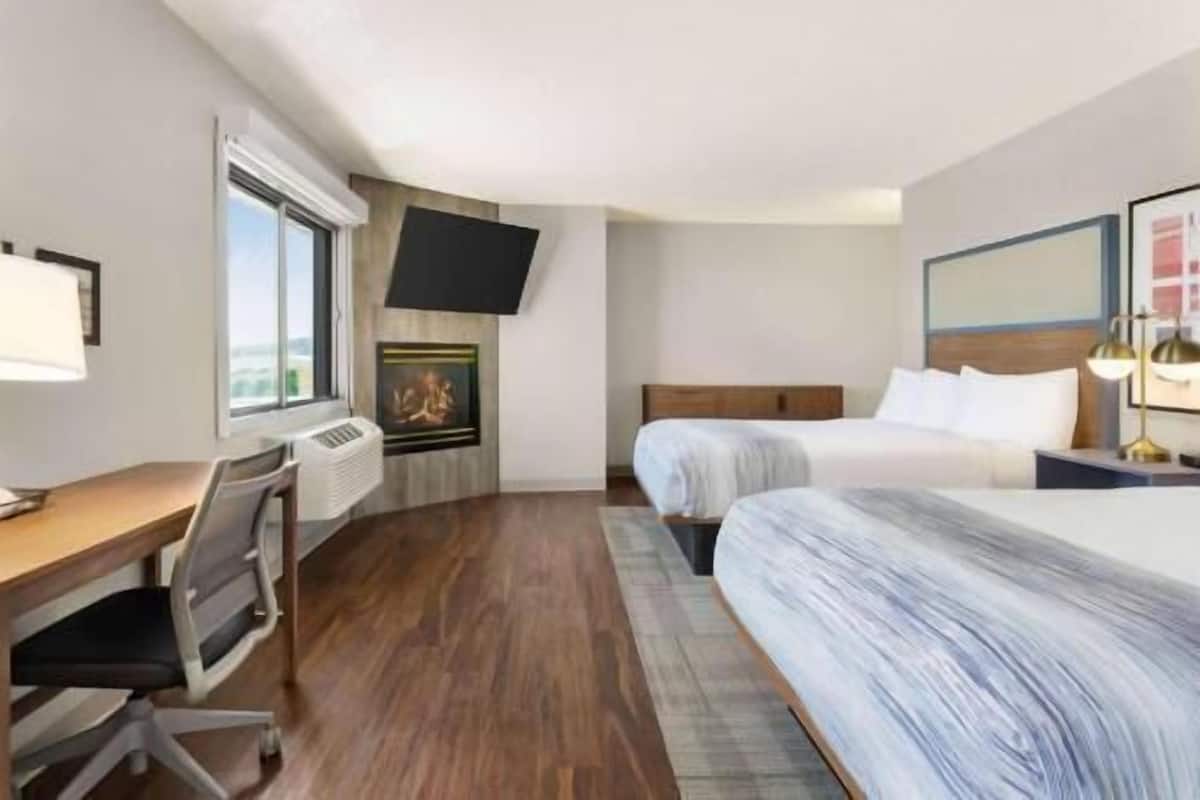 Desk, laptop workspace, blackout drapes, iron/ironing board