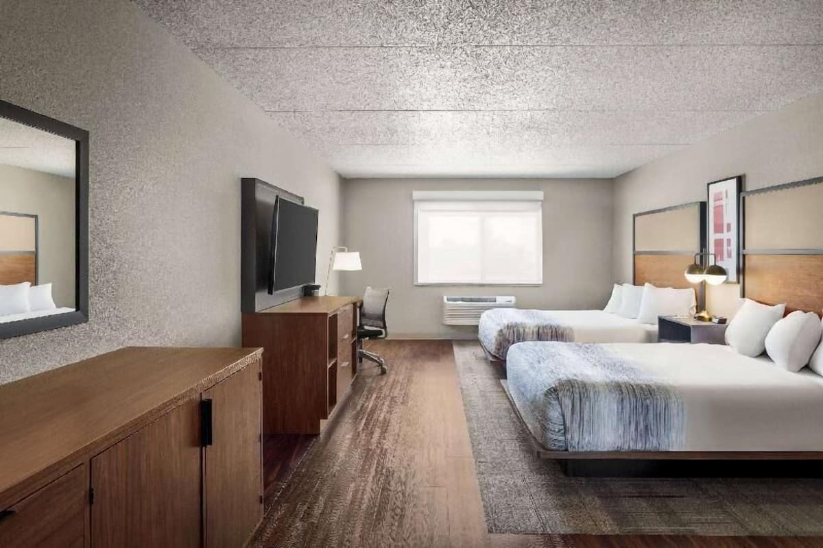 Desk, laptop workspace, blackout drapes, iron/ironing board