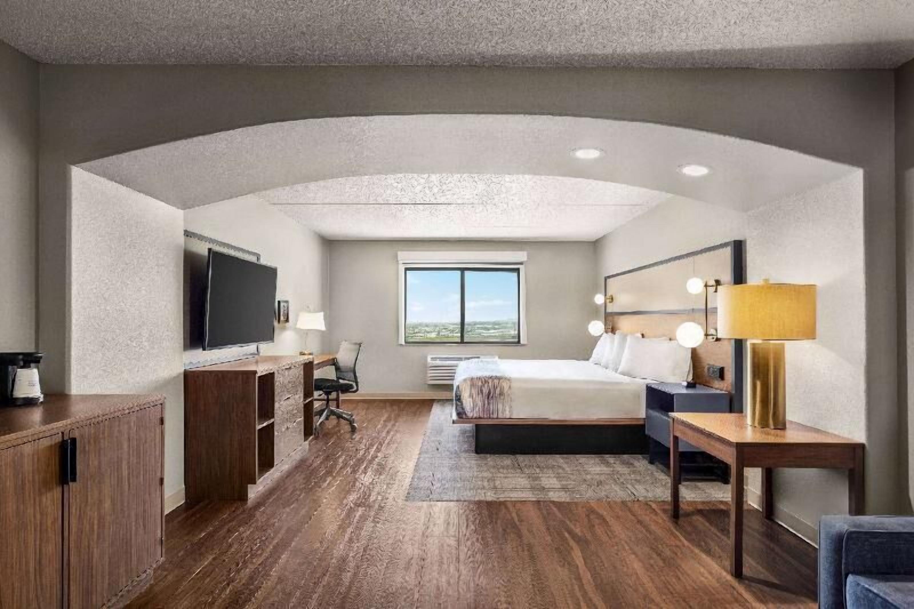 Desk, laptop workspace, blackout drapes, iron/ironing board