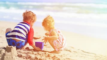 On the beach, surfing