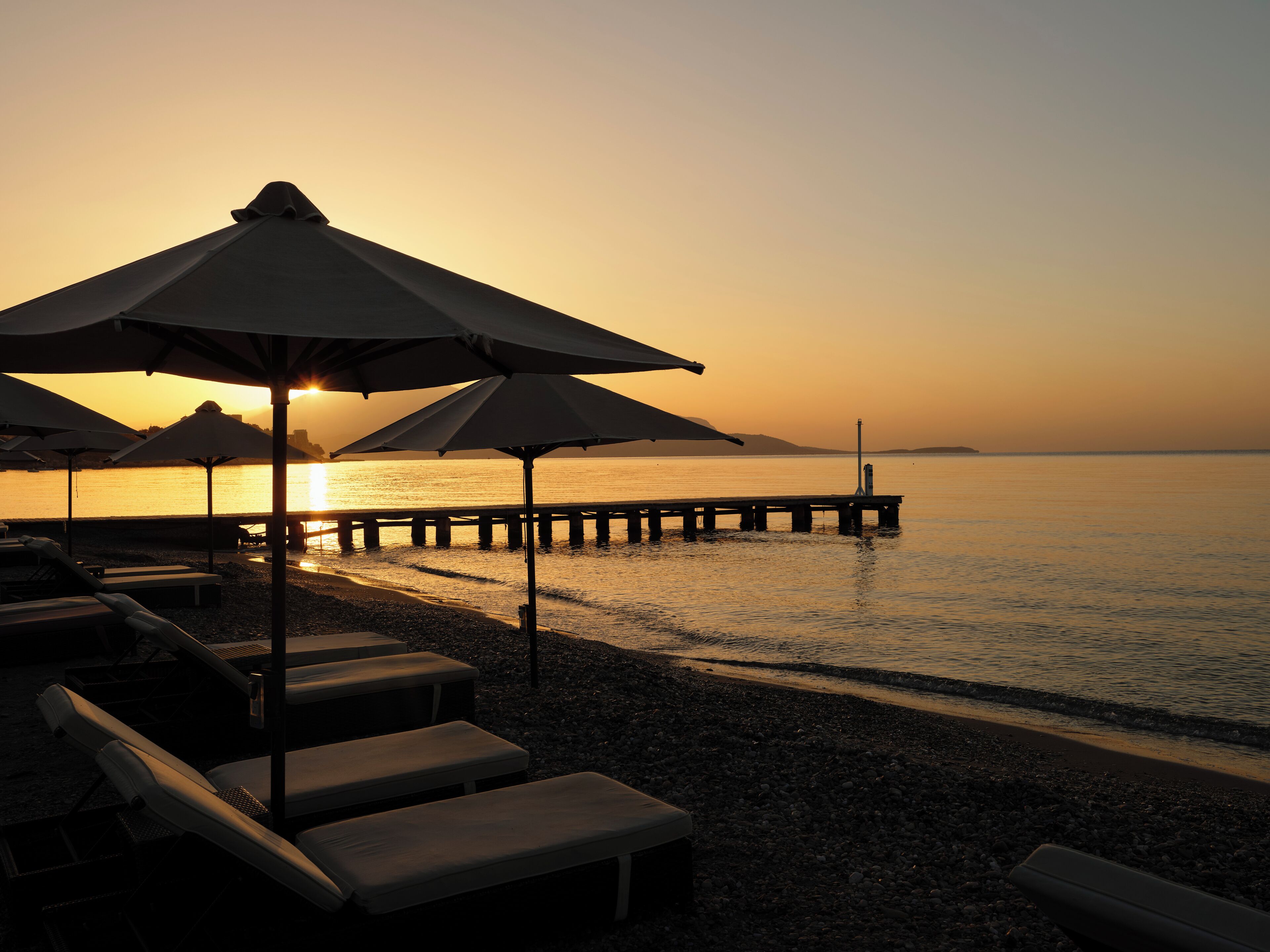 on the beach, sun-loungers, beach umbrellas, beach towels