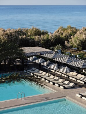 2 outdoor pools, pool umbrellas, pool loungers
