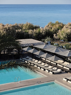 2 outdoor pools, pool umbrellas, pool loungers