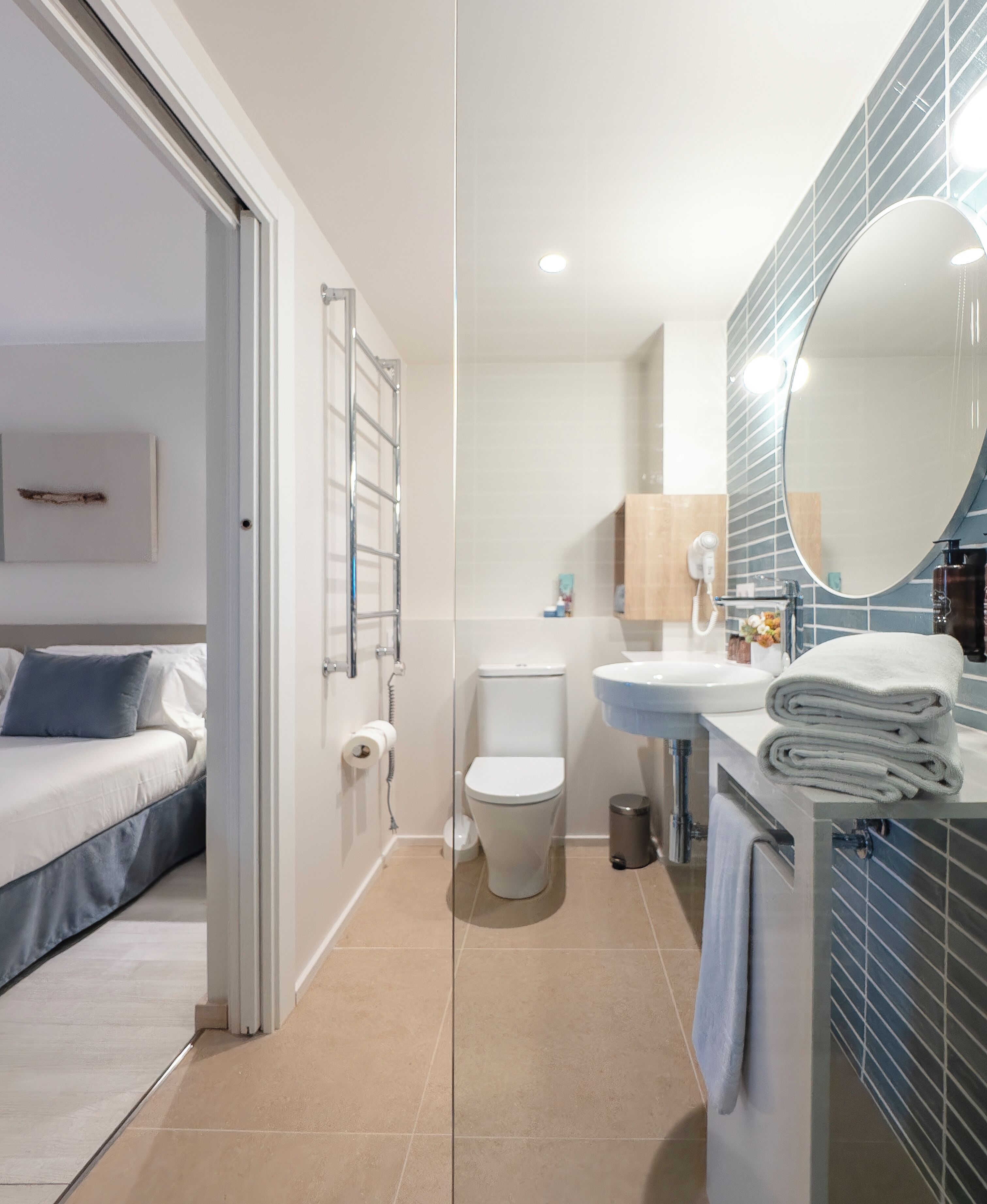 shower, rainfall showerhead, hair dryer, towels