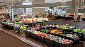 A buffet with various food options, including salads, fruits, and vegetables. - Hotel Prestige Sant Marc (Roses)