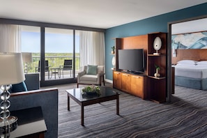 Junior Suite, 1 King Bed with Sofa bed | Living area | 49-inch Smart TV with cable channels, TV