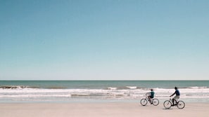 On the beach, white sand, beach umbrellas, beach towels