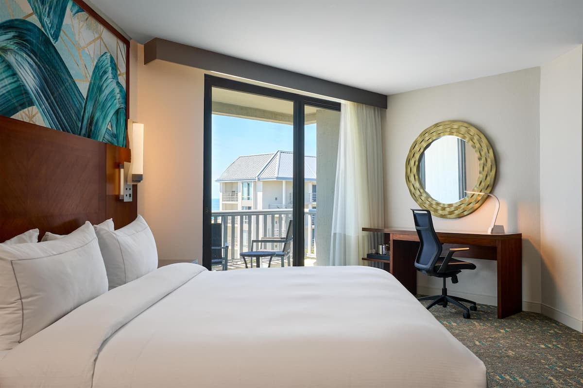Deluxe Room, 1 King Bed, Partial Ocean View | Pillowtop beds, in-room safe, desk, blackout drapes