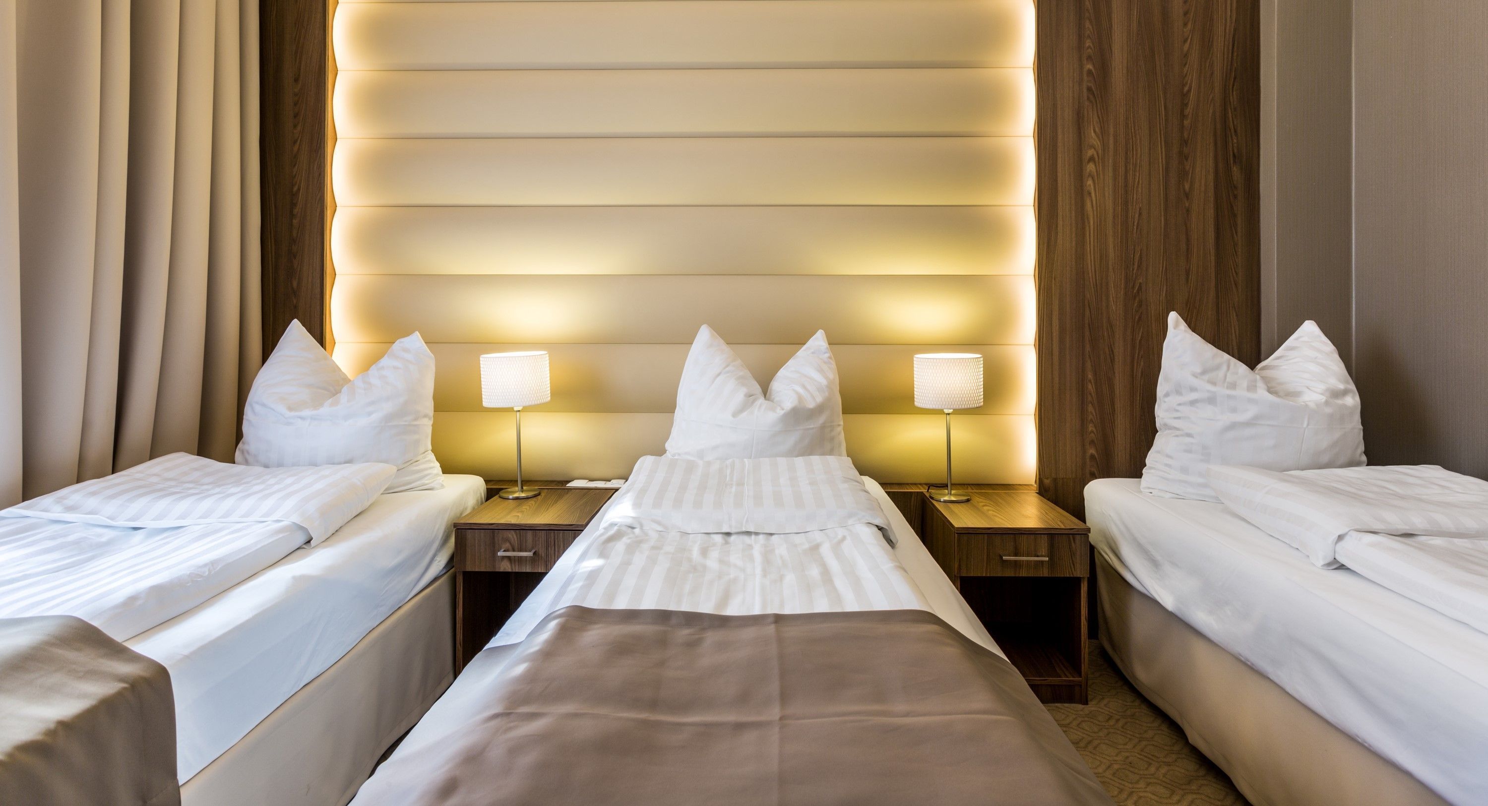 deluxe triple room, 1 bedroom, bathtub | hypo-allergenic bedding, in-room safe, desk, laptop workspace