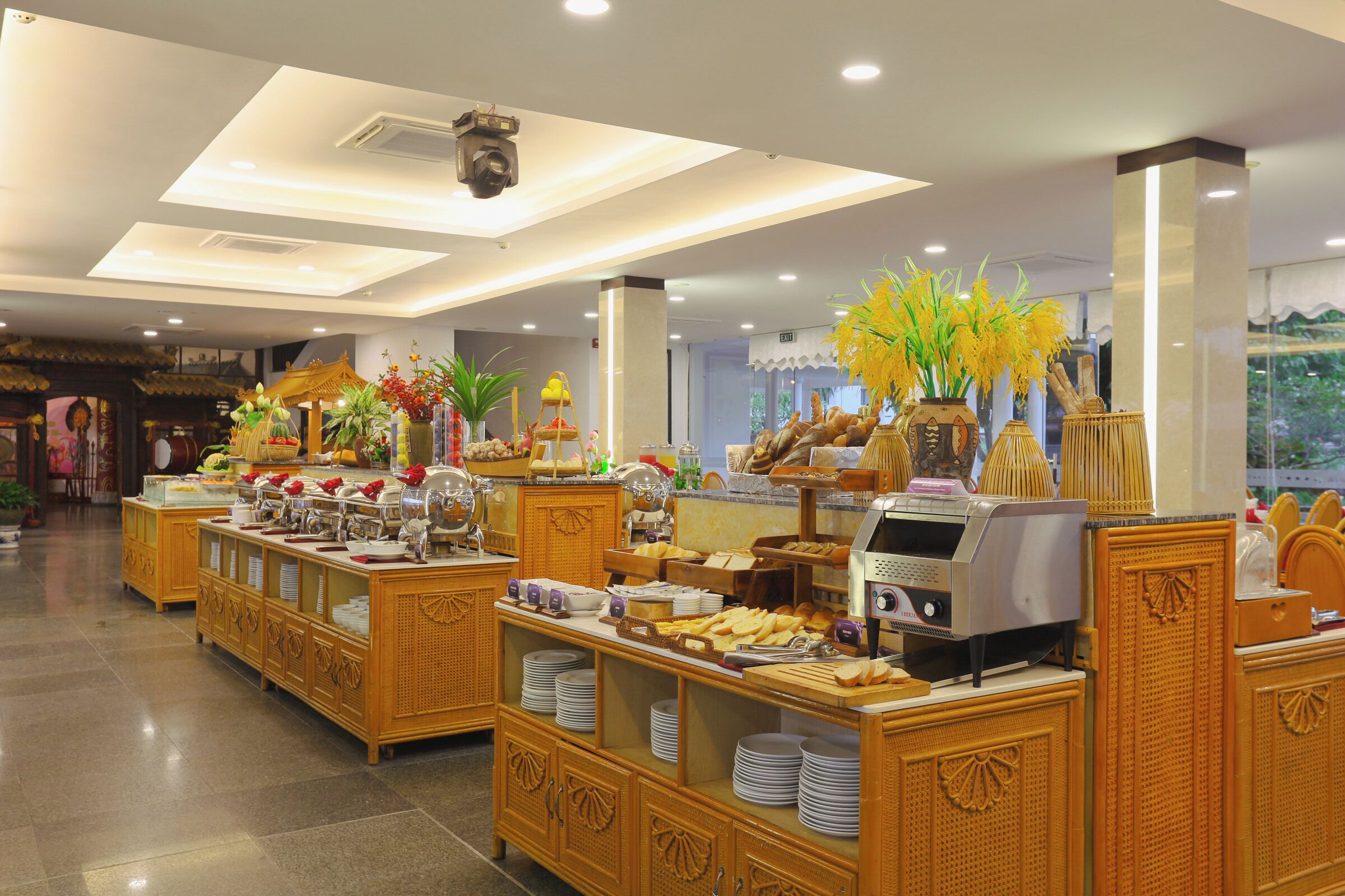 A buffet area with various food items and a self-service station.