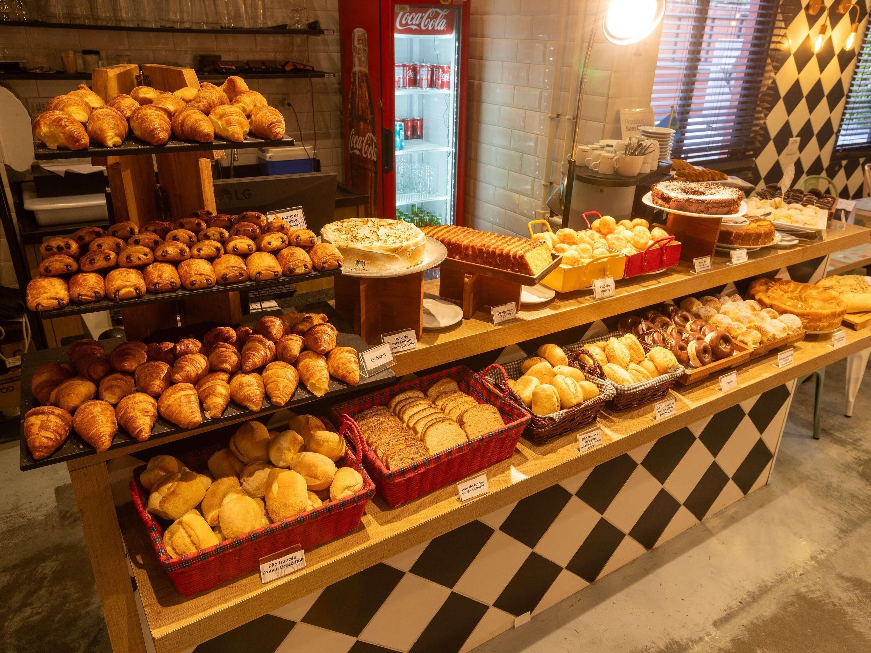 A bakery display with various baked goods.