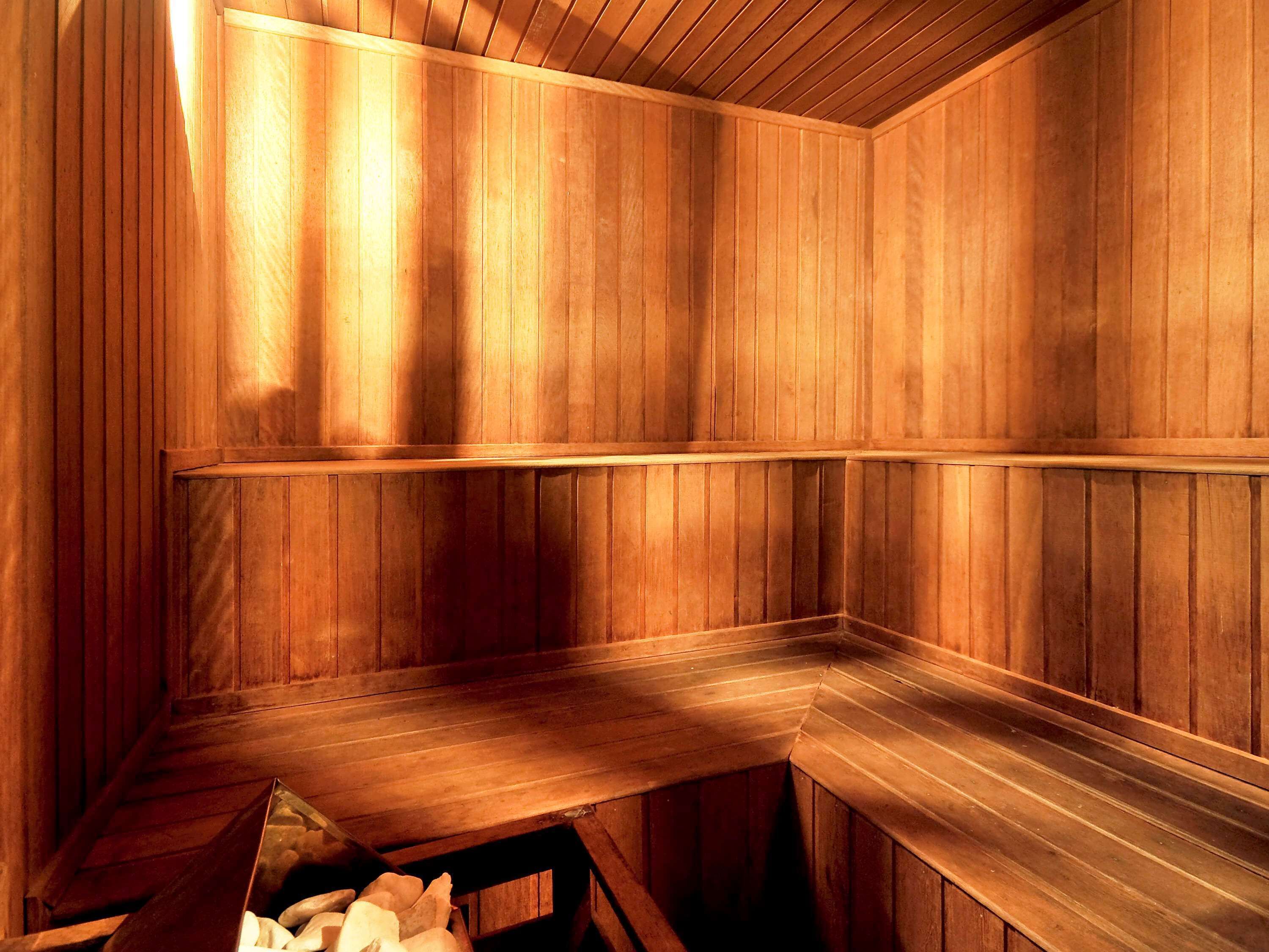 A sauna with wooden walls and benches.