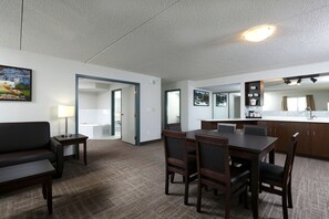 Executive Suite, 1 King Bed with Sofa bed, Jetted Tub | Living room | 50-inch flat-screen TV with cable channels, TV