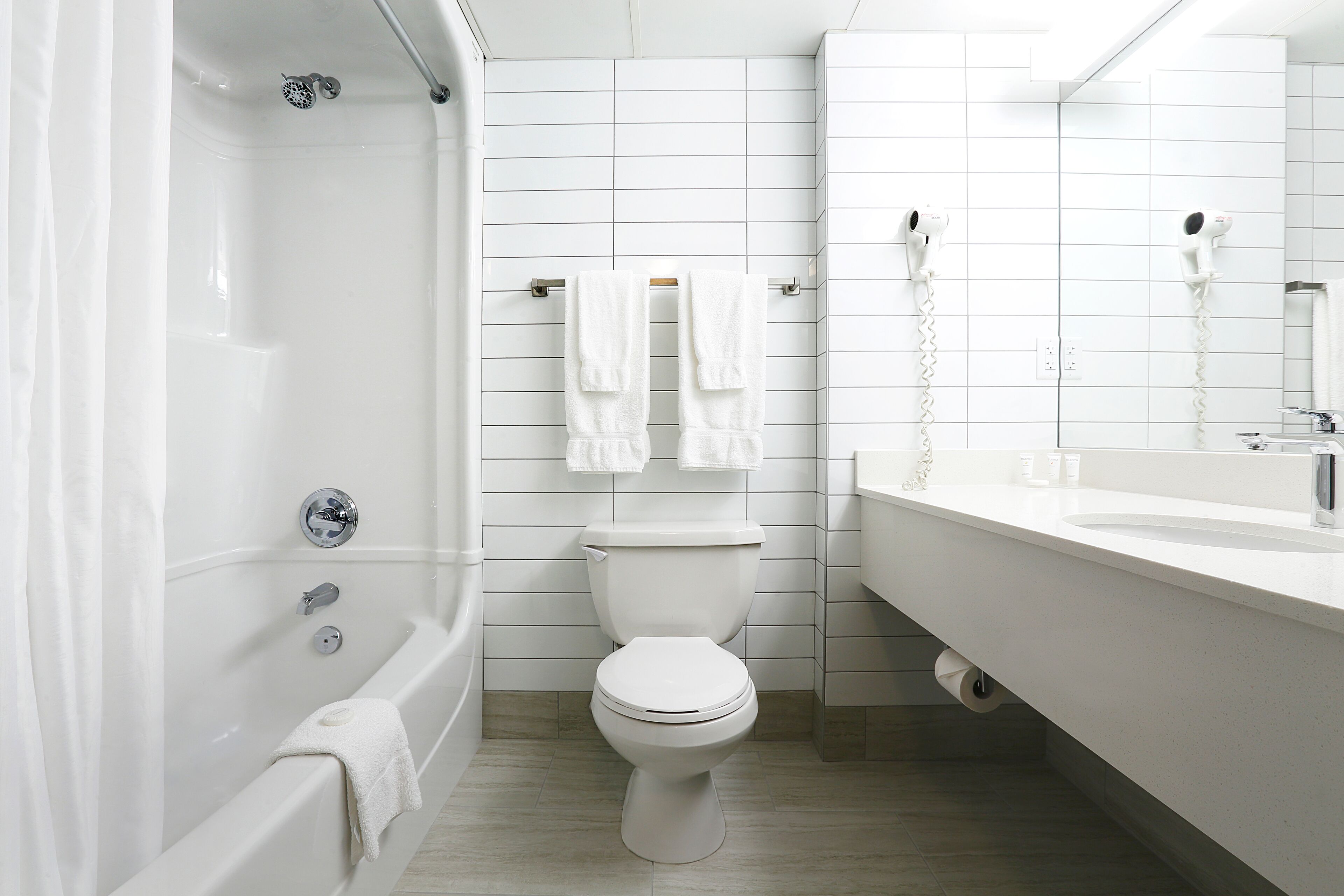 combined shower/bathtub, free toiletries, hair dryer, towels