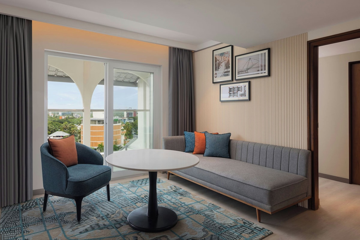 Family Suite, 2 Bedrooms | Living area | 32-inch LCD TV with satellite channels, TV
