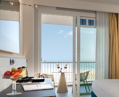 Deluxe Double Room Single Use, Sea Facing | Minibar, in-room safe, blackout drapes, soundproofing