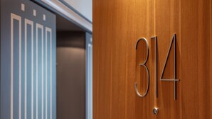 A wooden door with the number 314.