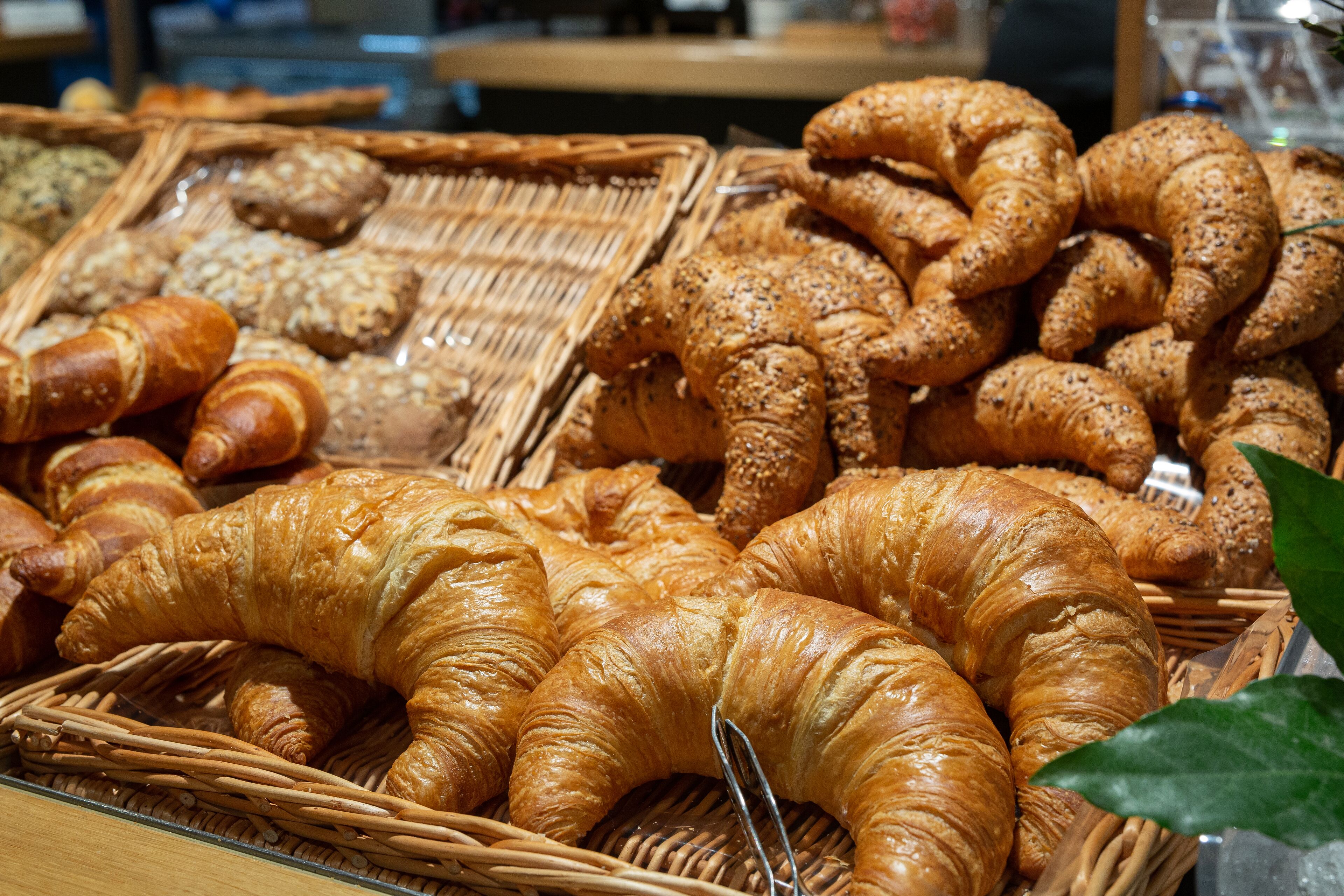 A variety of baked goods displayed in baskets.