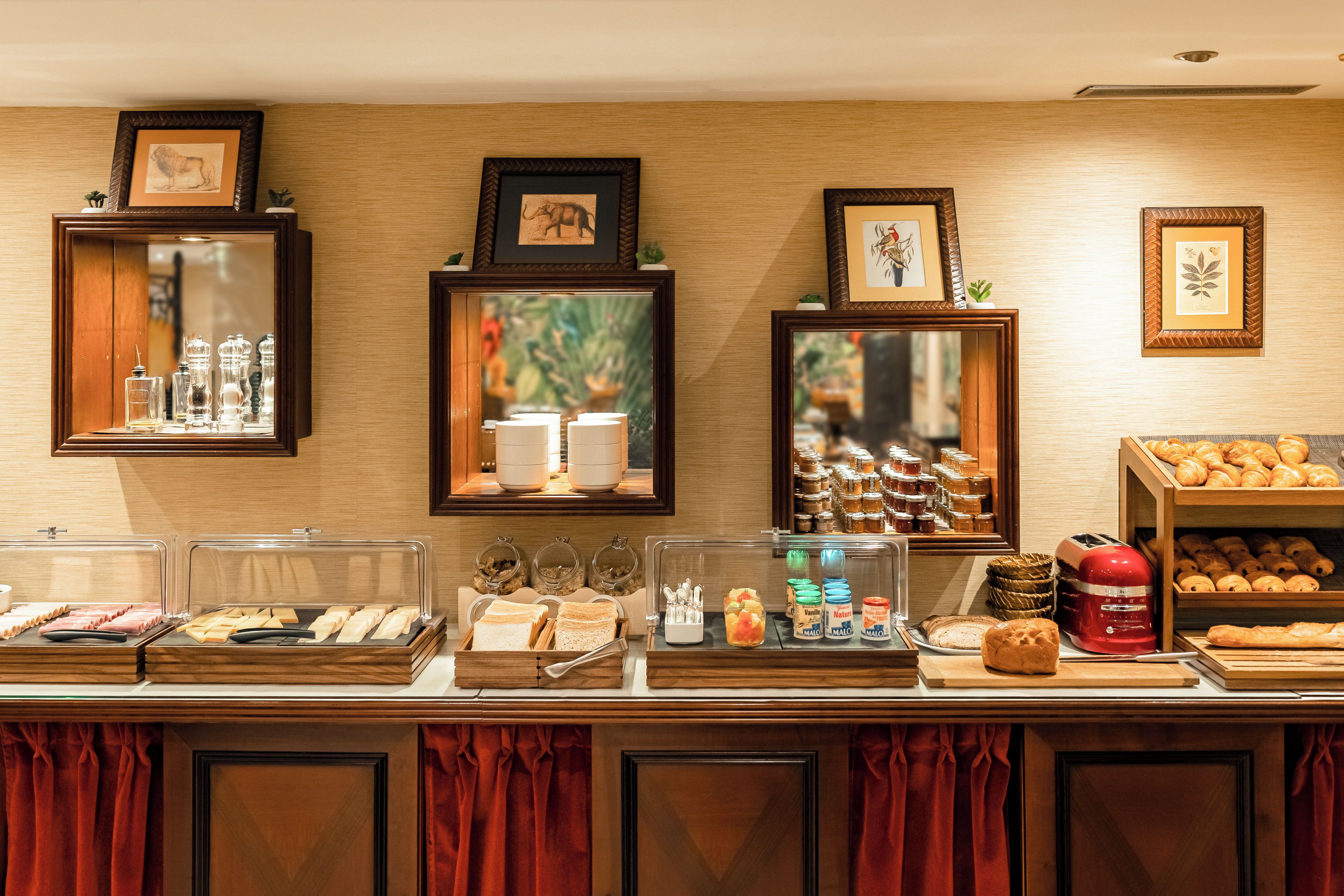 A breakfast buffet with various food items and condiments.