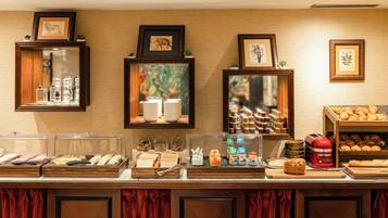 A breakfast buffet with various food items and condiments.