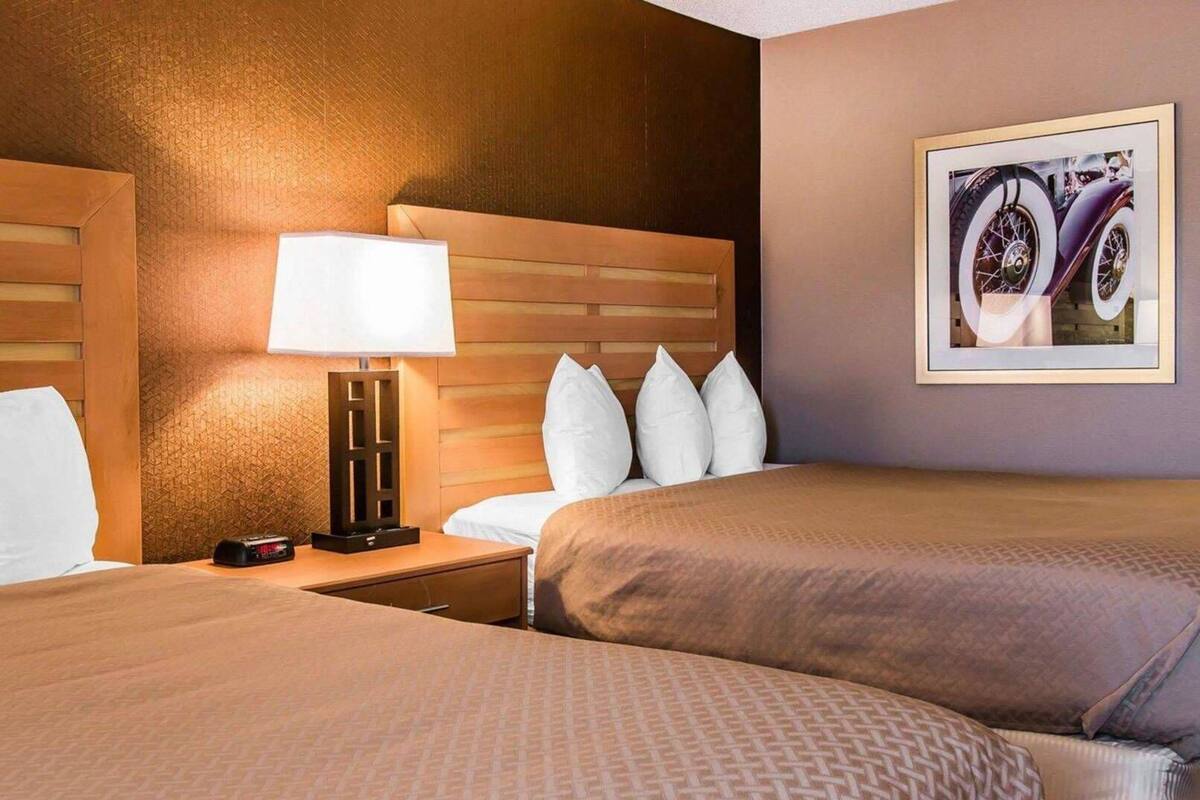 Down comforters, desk, blackout drapes, iron/ironing board