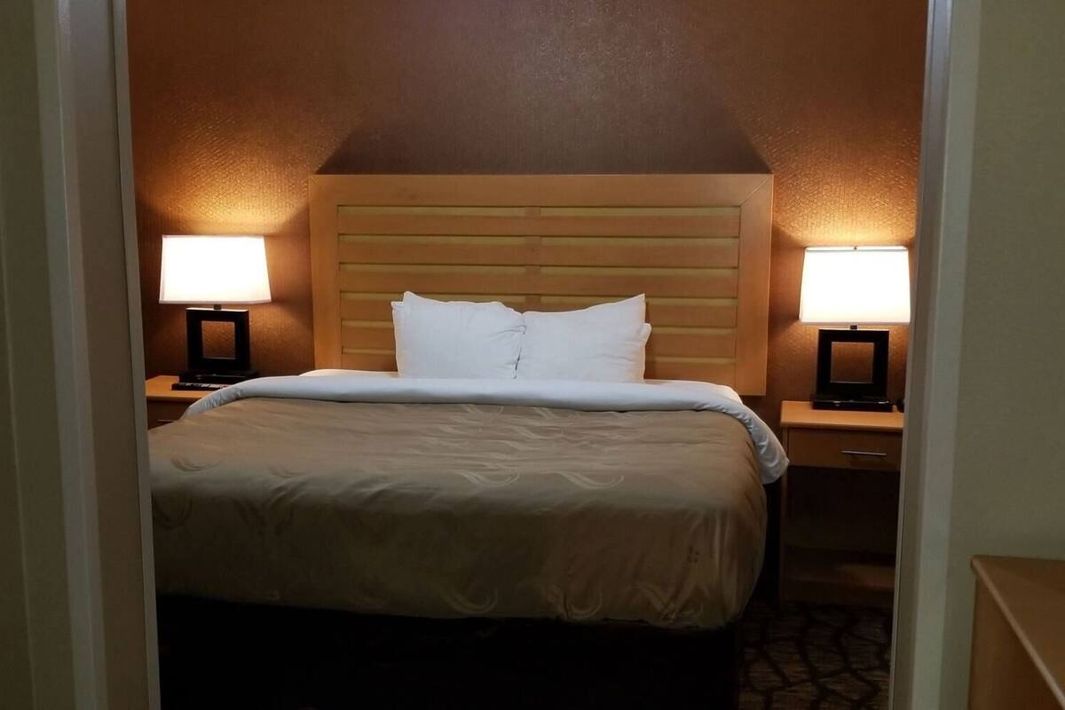 Down comforters, desk, blackout drapes, iron/ironing board