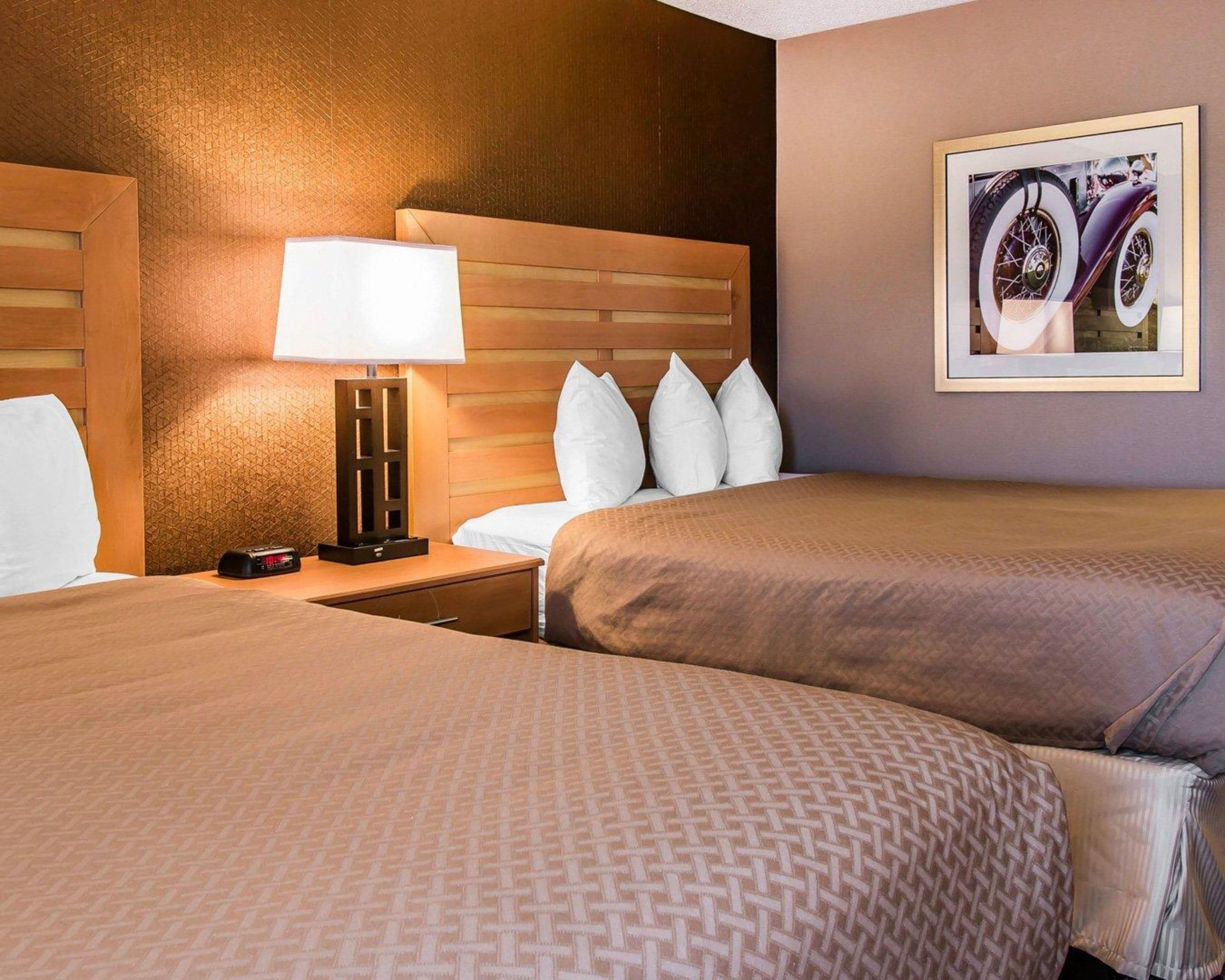 standard room, 2 queen beds, non smoking | down duvets, desk, blackout curtains, iron/ironing board