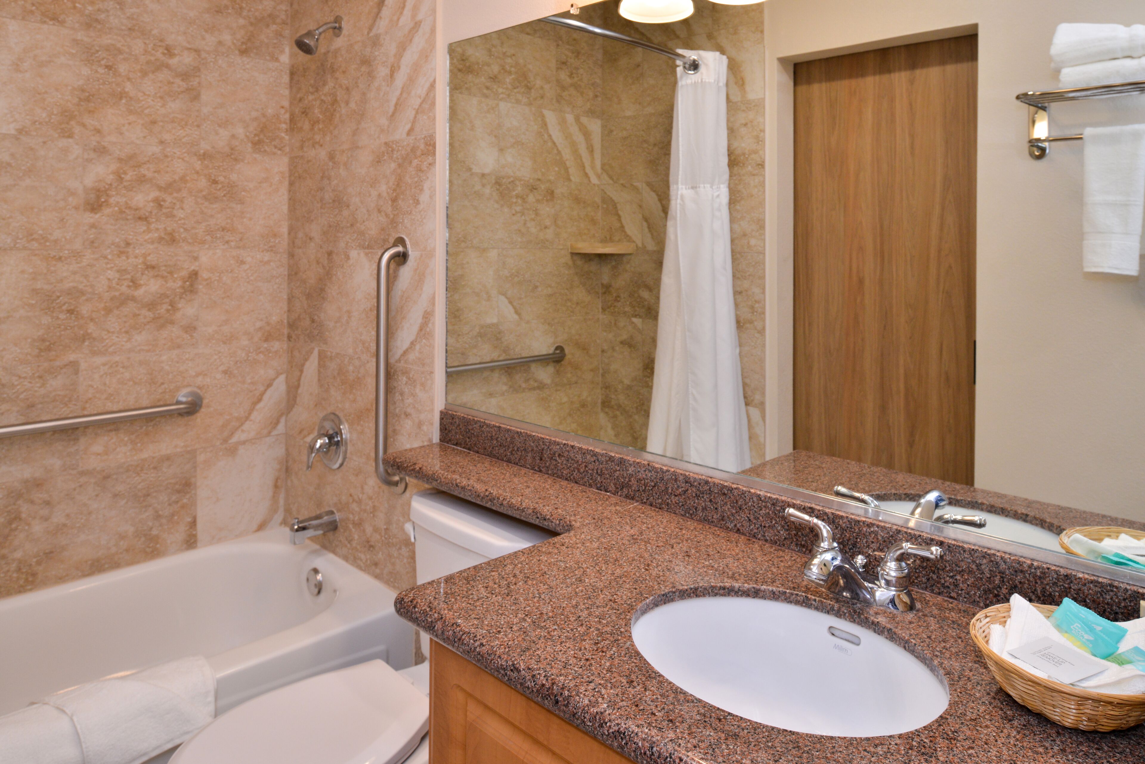 suite, 1 king bed with sofa bed, non smoking | bathroom | eco-friendly toiletries, hair dryer, towels, soap