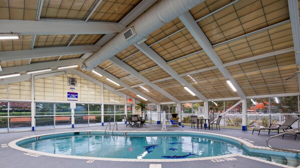 Indoor pool, open 9:00 AM to 9:00 PM, pool loungers