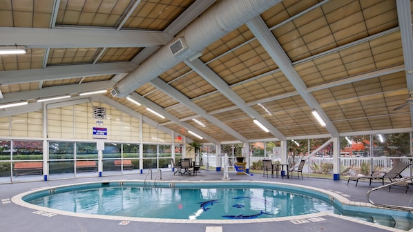 Indoor pool, open 9:00 AM to 9:00 PM, pool loungers