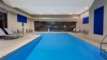 Indoor pool, open 6:00 AM to 11:00 PM, pool loungers