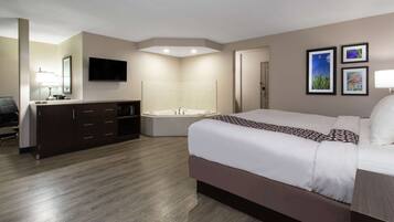 Chambre Deluxe, 1 trĂšs grand lit, non-fumeurs, baignoire Ă jets | Bureau, espace de travail pour ordinateur portable, rideaux occultants