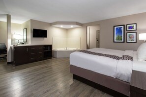 Deluxe Room, 1 King Bed, Non Smoking, Jetted Tub | Desk, laptop workspace, blackout drapes, iron/ironing board
