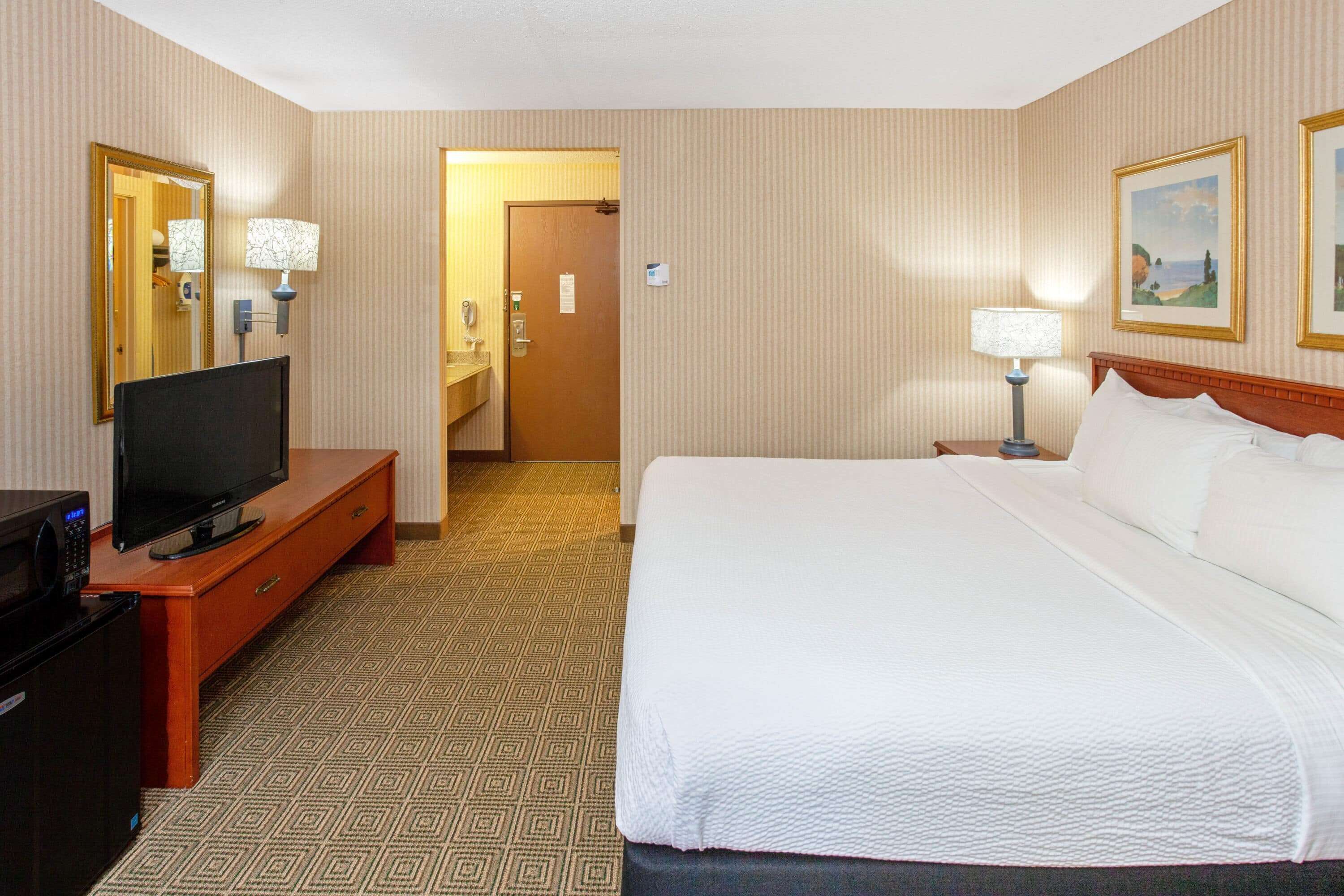 desk, laptop workspace, blackout curtains, iron/ironing board