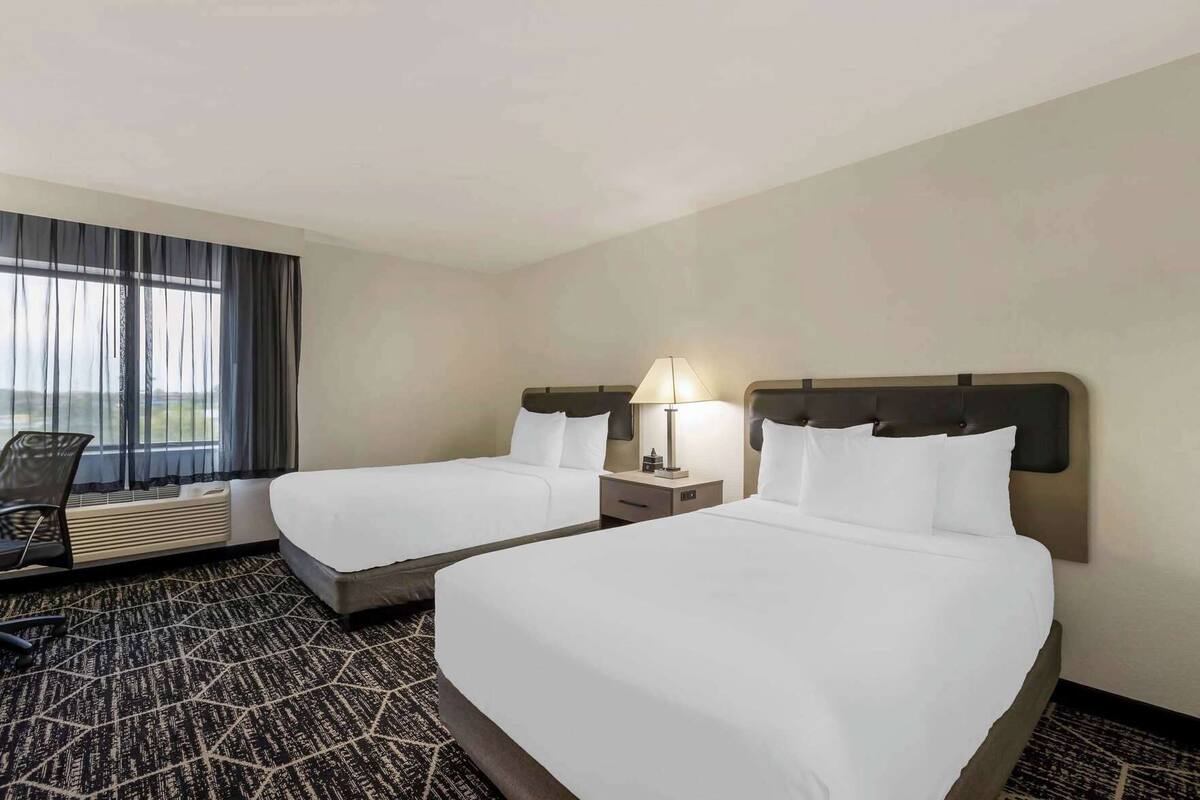 Premium bedding, desk, laptop workspace, iron/ironing board